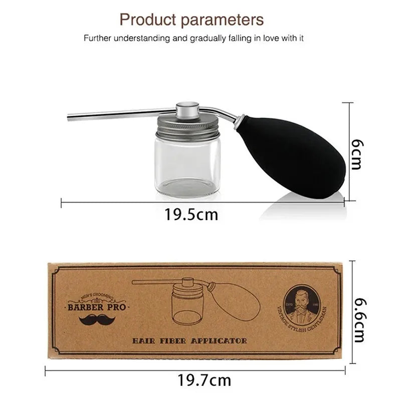 A clear glass and black silicone refillable hair fiber applicator bottle with a metal rod for precision styling.