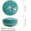 A teal stainless steel tongue drum with six holes and a round body, shown next to its dimensions.