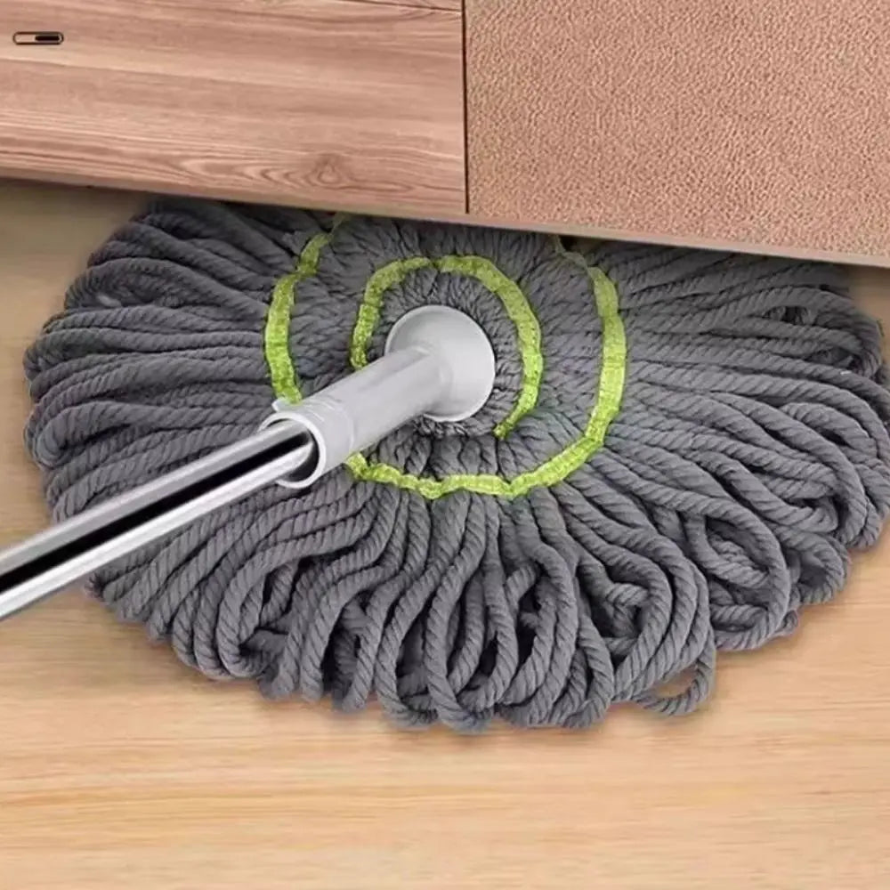 A gray rope of cleaning twine with a silver handle and green accents is shown on a wooden surface.