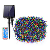 A solar panel connected to a string of colorful LED lights for outdoor decoration.