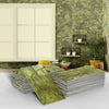 Stacks of marble self-adhesive wall stickers featuring green and gold veining against a textured gray wall.