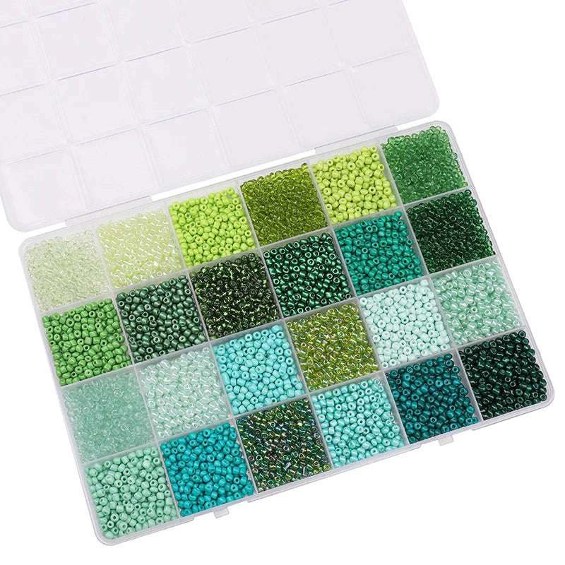 A plastic box filled with various colors of glass rice beads for jewelry making