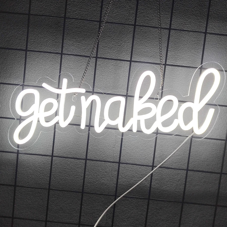 A white neon sign spelling out getnaked is suspended against a dark grid background.