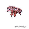 An embroidered letter patch spelling out TENNESSEE with a peach-colored bow.