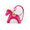 A pink leather pony charm with a gold checkered tag and a pink strap.