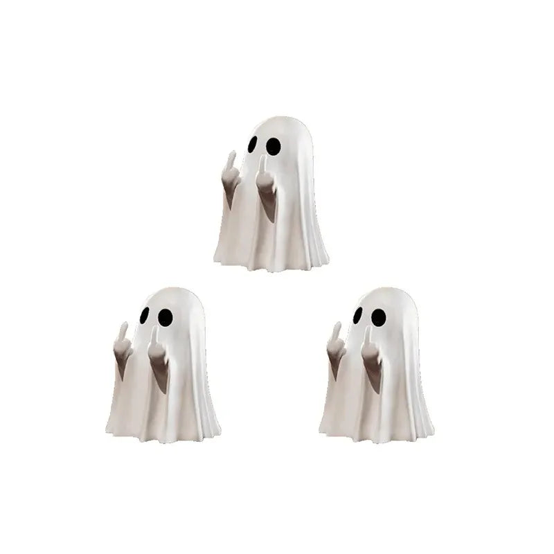 A white resin statue of a ghost with its finger raised, used as quirky Halloween decor.