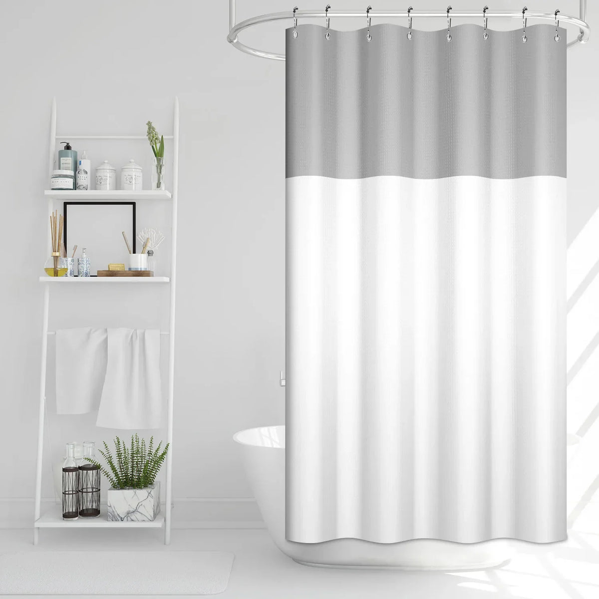 A waffle weave shower curtain with a geometric stripe pattern hanging in a bathroom.