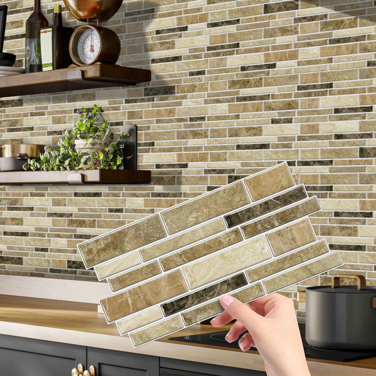 A hand is placing peel and stick waterproof tile stickers on a kitchen backsplash made of stacked rectangular tiles.