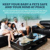A family of three is sitting on a couch in a modern living room, with furniture safety guards visible.