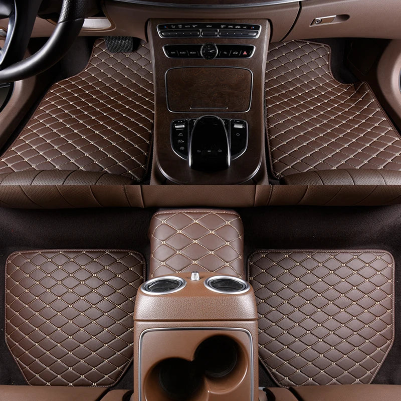 Interior view of a car showing waterproof leather floor mats and controls.