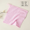A pink, fluffy organic cotton face towel is shown flat on a light background.