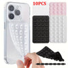 A clear silicone suction cup phone mount with multiple silicone suction cups and a black silicone grip shown next to a smartp