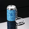 A light blue metal coin tube keychain with a silver cap and chain, reflecting on a surface.