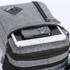 A gray lightweight crossbody sling bag with a zippered pocket holding a smartphone.