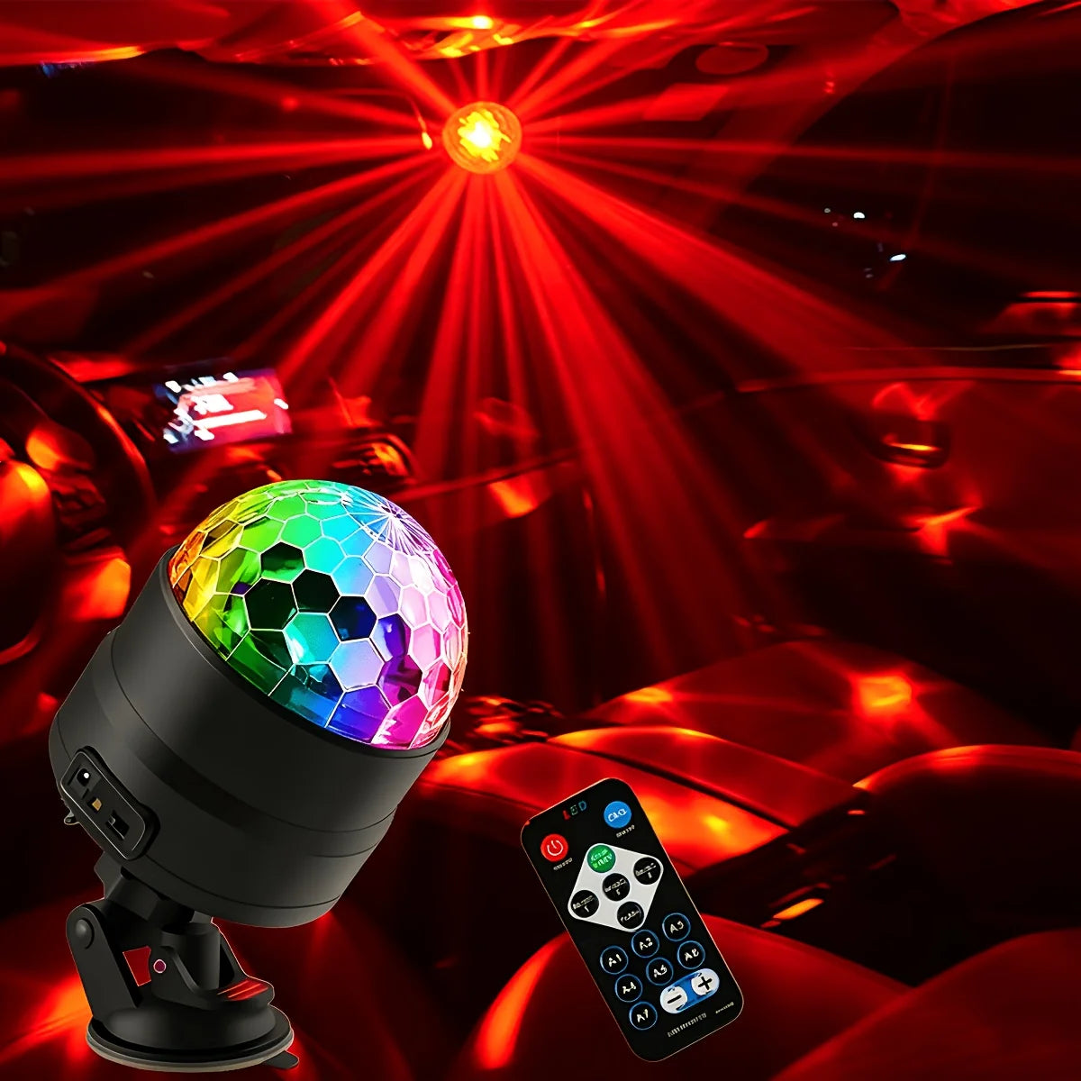 A remote control disco ball party light is shown in a car interior with bright red lighting.