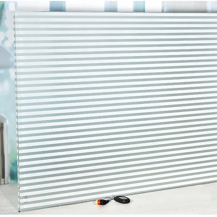 Frosted privacy window film with a horizontal striped pattern installed on a window.