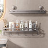 A silver wall-mounted shower caddy with suction cups holds various toiletries and grooming products.