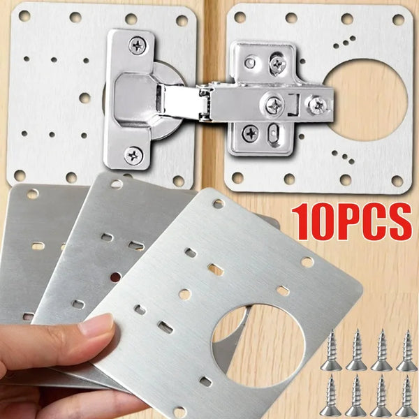 Placas y herrajes de montaje para reparar bisagras de gabinete de acero inoxidable sobre una superficie de madera.