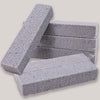 Stack of gray foam glass pumice stone cleaning brushes for toilets and sinks