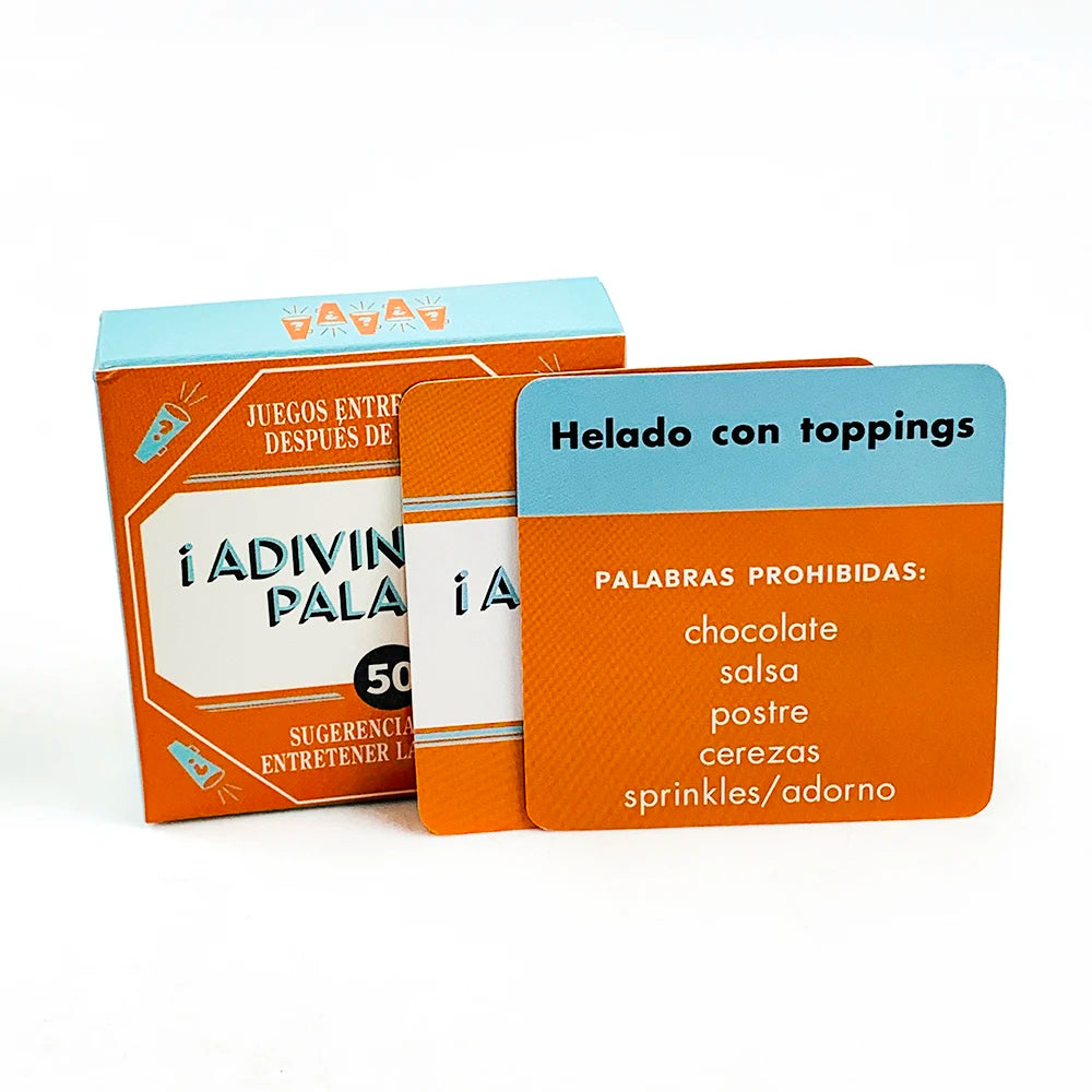 A box of the Name That Word card game in orange and blue packaging with a card labeled Helado con toppings