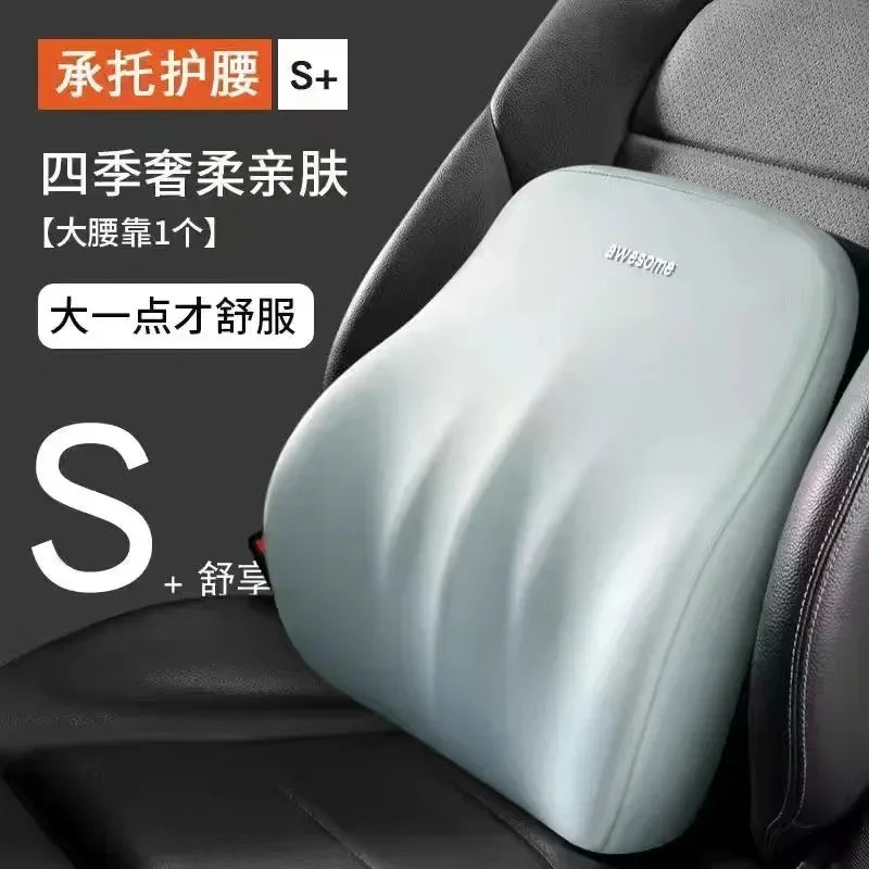 Light blue memory foam car headrest and lumbar support pillow placed in a dark car seat.