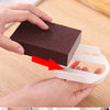Before and after comparison showing a heavy-duty emery sponge used for cleaning pots and pans.