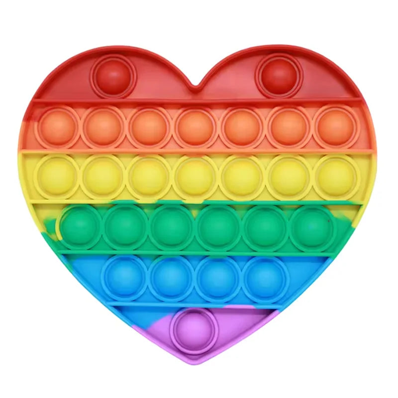 A heart-shaped rainbow colored pop bubble fidget toy with multiple colored bubbles.