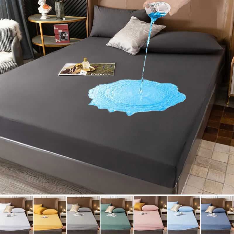 Una funda protectora para colchón de color gris oscuro con un líquido azul derramándose sobre la superficie.