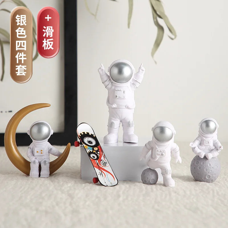 A set of handcrafted astronaut figurines in various colors and a wooden crescent moon on a desk