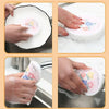 Hands are shown using pink cotton scouring sponges to clean a white plate and sink area.