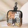 A black mini coin purse featuring a collage of various cat faces in shades of orange, gray, and white.