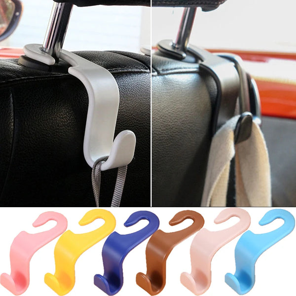 A collection of various colored universal car seat headrest hooks for securing items.