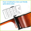 An adjustable guitar phone stand is mounted on the body of an acoustic guitar for hands-free viewing.