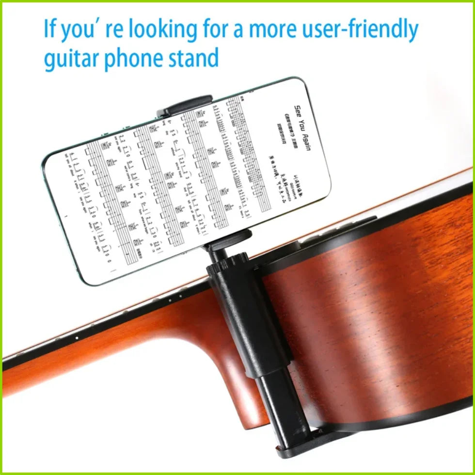 An adjustable guitar phone stand is mounted on the body of an acoustic guitar for hands-free viewing.