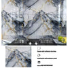 Marble effect peel-and-stick wallpaper featuring gray and gold veining on a kitchen backsplash.