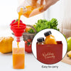 A hand pours orange juice from a plastic bottle into a glass, demonstrating the easy to carry feature of reusable juice bottl