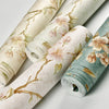 Rolls of 3D embossed floral self-adhesive wallpaper in soft green and beige tones.