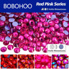 A close-up view of a pile of vibrant red pink rhinestones used for DIY crafts and clothing decoration.