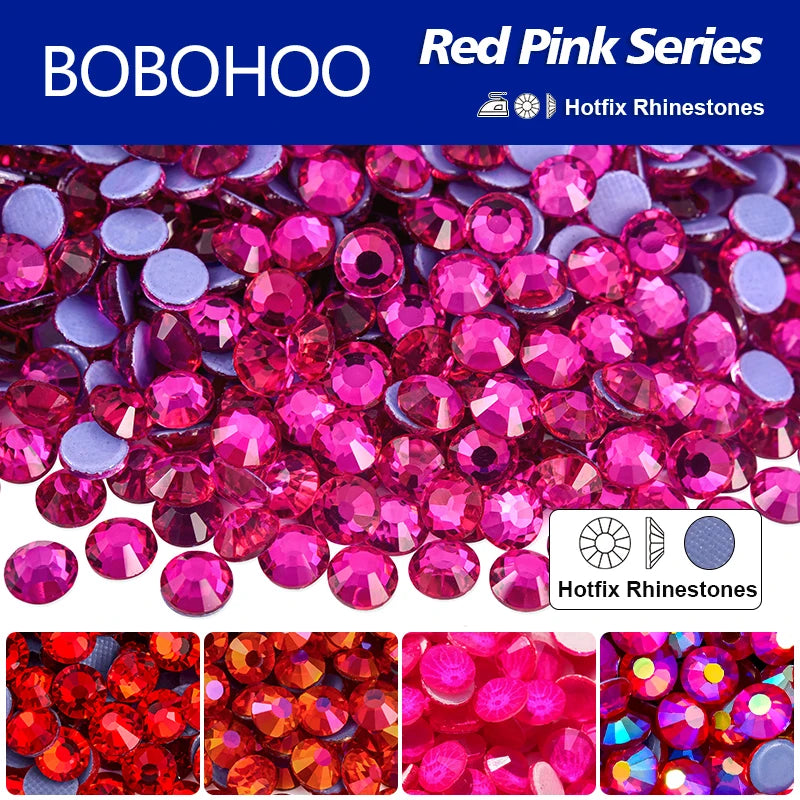 A close-up view of a pile of vibrant red pink rhinestones used for DIY crafts and clothing decoration.