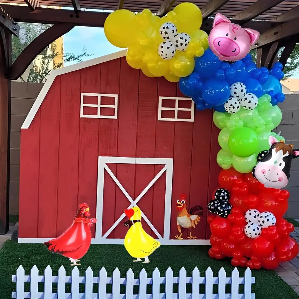 A balloon arch kit featuring a red barn facade and cow print balloons for a farm-themed party display.