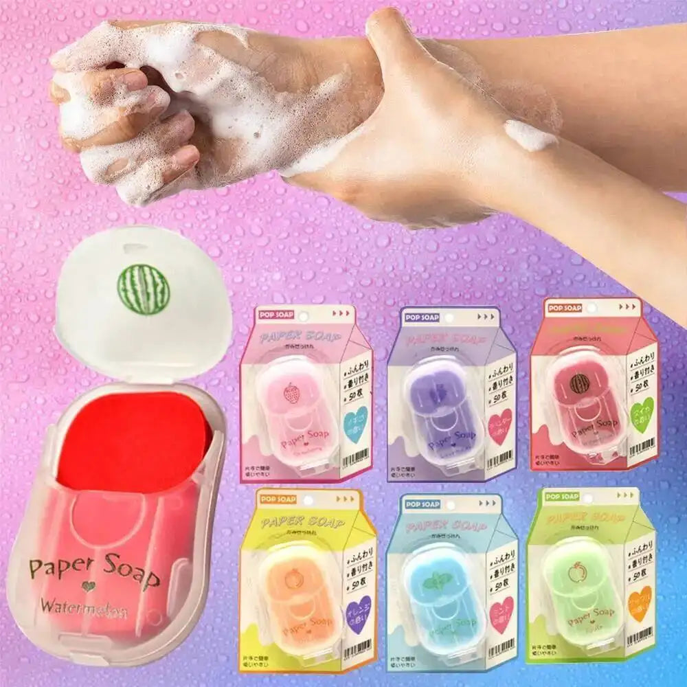 A hand is lathering with white soap, next to various packaged paper soap sheets for travel.