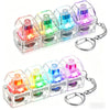 A set of colorful LED macaron keyboard fidget toys packaged as a keychain.