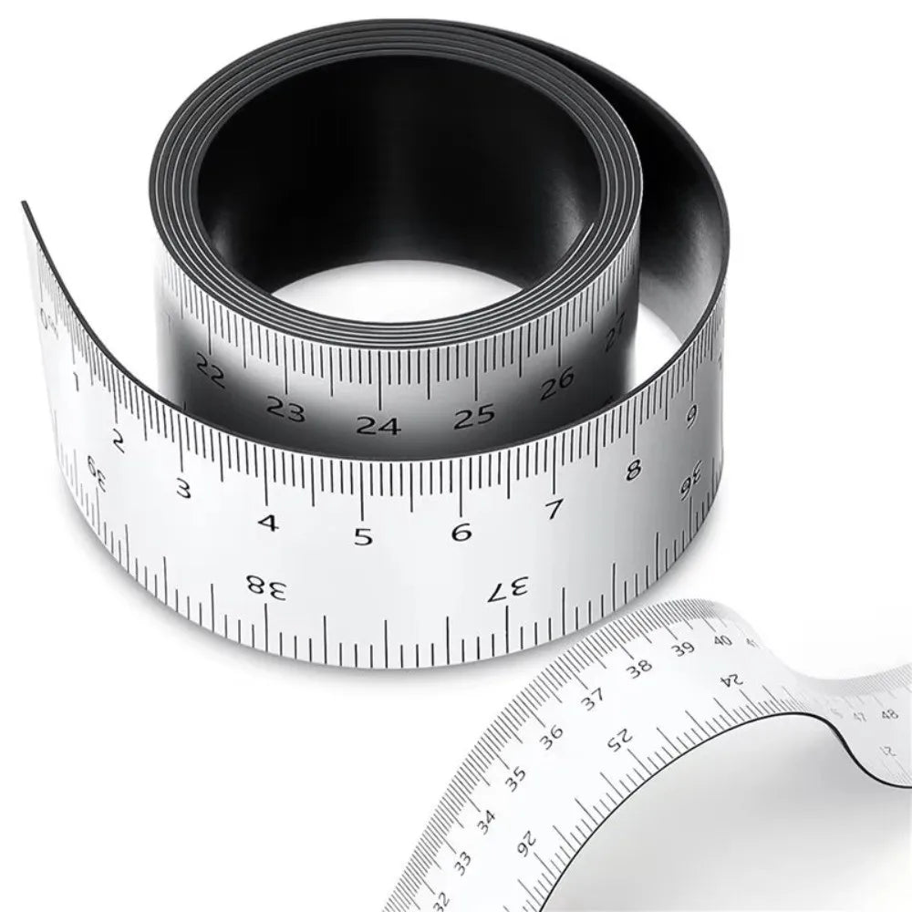 A black magnetic flexible measuring ruler with a white scale is shown, including a coiled and an uncoiled version.