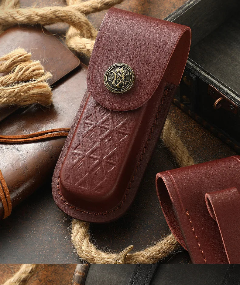 A dark brown genuine leather folding knife case with a brass emblem is shown next to natural twine.
