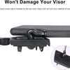 A close-up view of a black screw cap covering the sun visor clips on a vehicle.