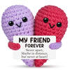 Two handmade crochet animal dolls, one purple and one red, with a card that reads My Friend Forever.