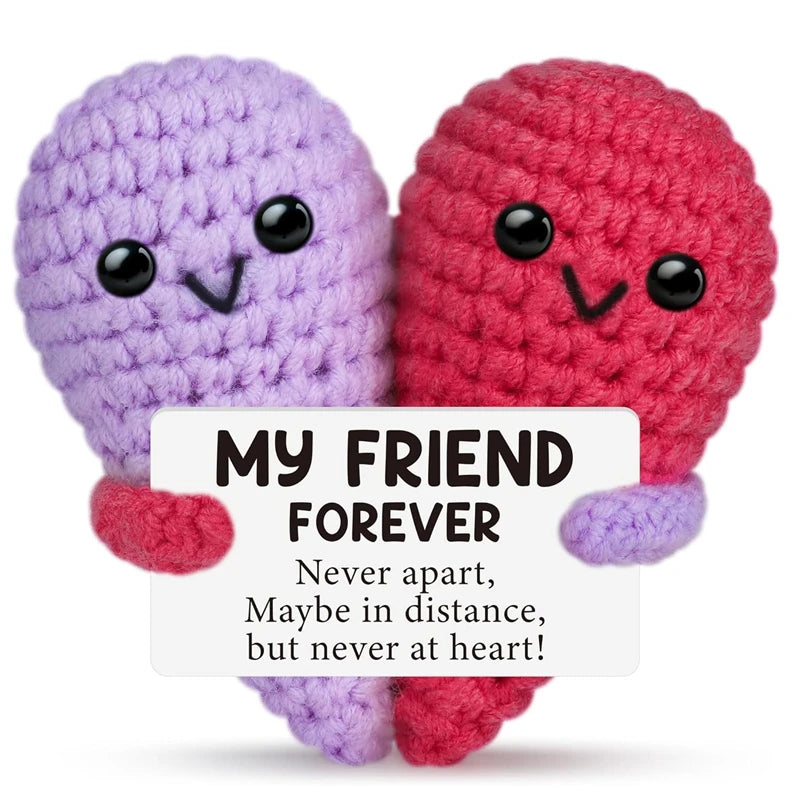 Two handmade crochet animal dolls, one purple and one red, with a card that reads My Friend Forever.