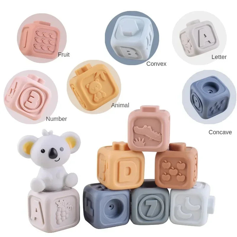 A collection of soft silicone building blocks in various shapes and colors including fruit, letter, animal, convex, and conca