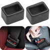 Two black protective covers for car seatbelt buckles shown in different angles