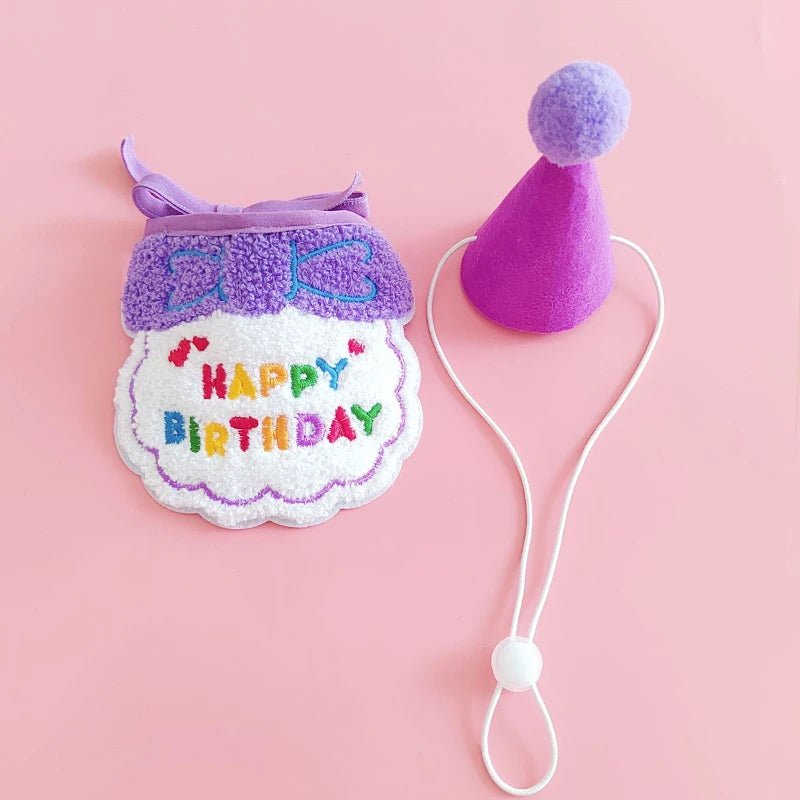 A purple pet birthday party hat and bib set for cats and small dogs with a white cord.